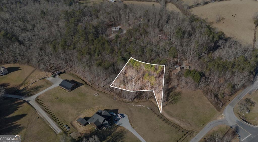 Lot 29 Ideal Acres Road Otto, NC 28763 - Photo 11 of 12 an aerial view of a house with table and chairs