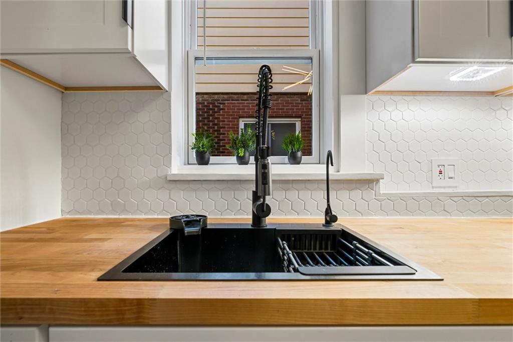 56 Bascom Avenue Pittsburgh, PA 15214 - Photo 11 of 46 a kitchen with a sink and cabinets