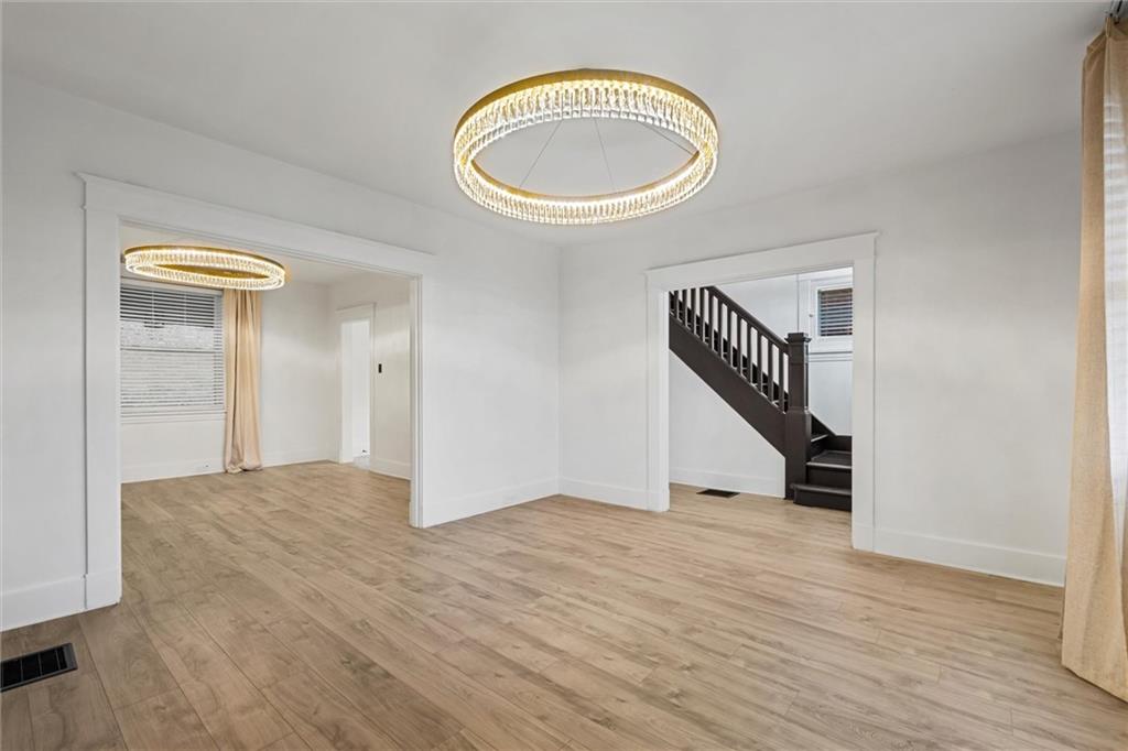 56 Bascom Avenue Pittsburgh, PA 15214 - Photo 5 of 46 a view of a room with wooden floor and staircase