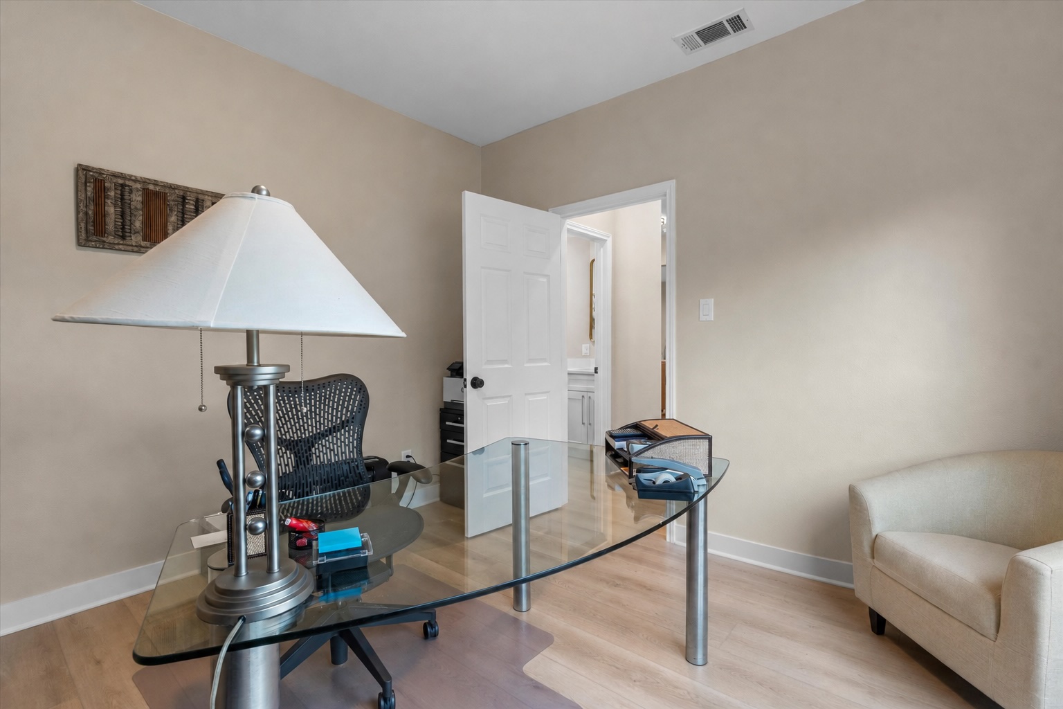 307 Hurst Creek Road Austin, TX 78734 - Photo 15 of 40 Light wood-finish flooring complements neutral wall tones