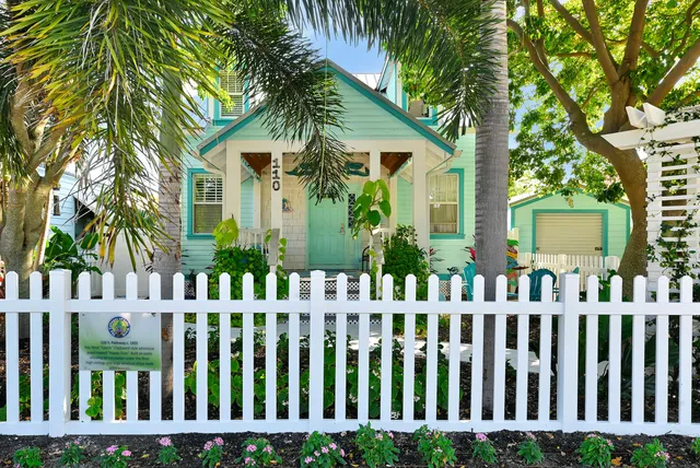 a kitchen with stainless steel appliances a white refrigerator freezer a sink and dishwasher