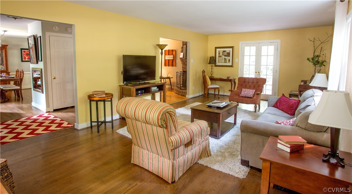 10301 Apache Road Richmond, VA 23235 - Photo 7 of 24 a living room with furniture and a flat screen tv