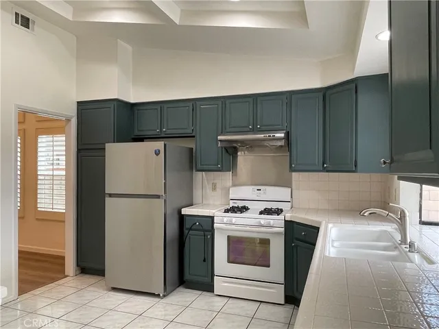 a room with pool table and a large window