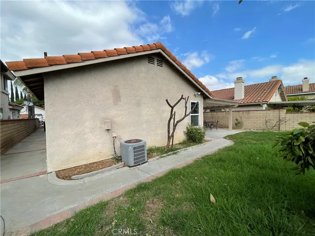 a view of a patio with table and chairs potted plants and a table