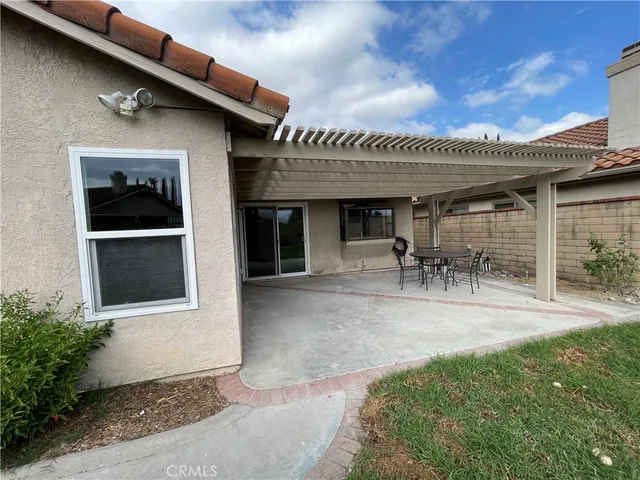 a living room with furniture a flat screen tv and couches