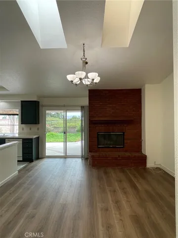 a living room with a fireplace and a flat screen tv