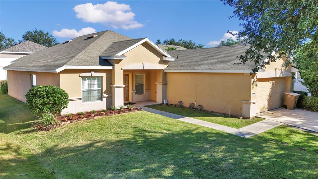 a front view of a house with a yard