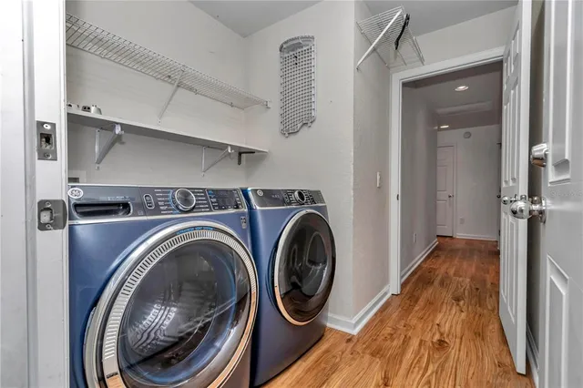 a view of storage and utility room with washer and dryer