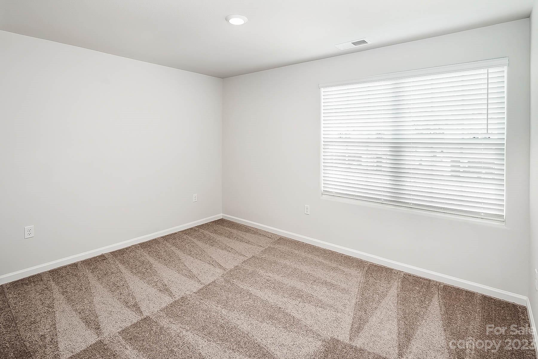 1620 Nia Road Charlotte, NC 28215 - Photo 12 of 14 a view of an empty room with a window