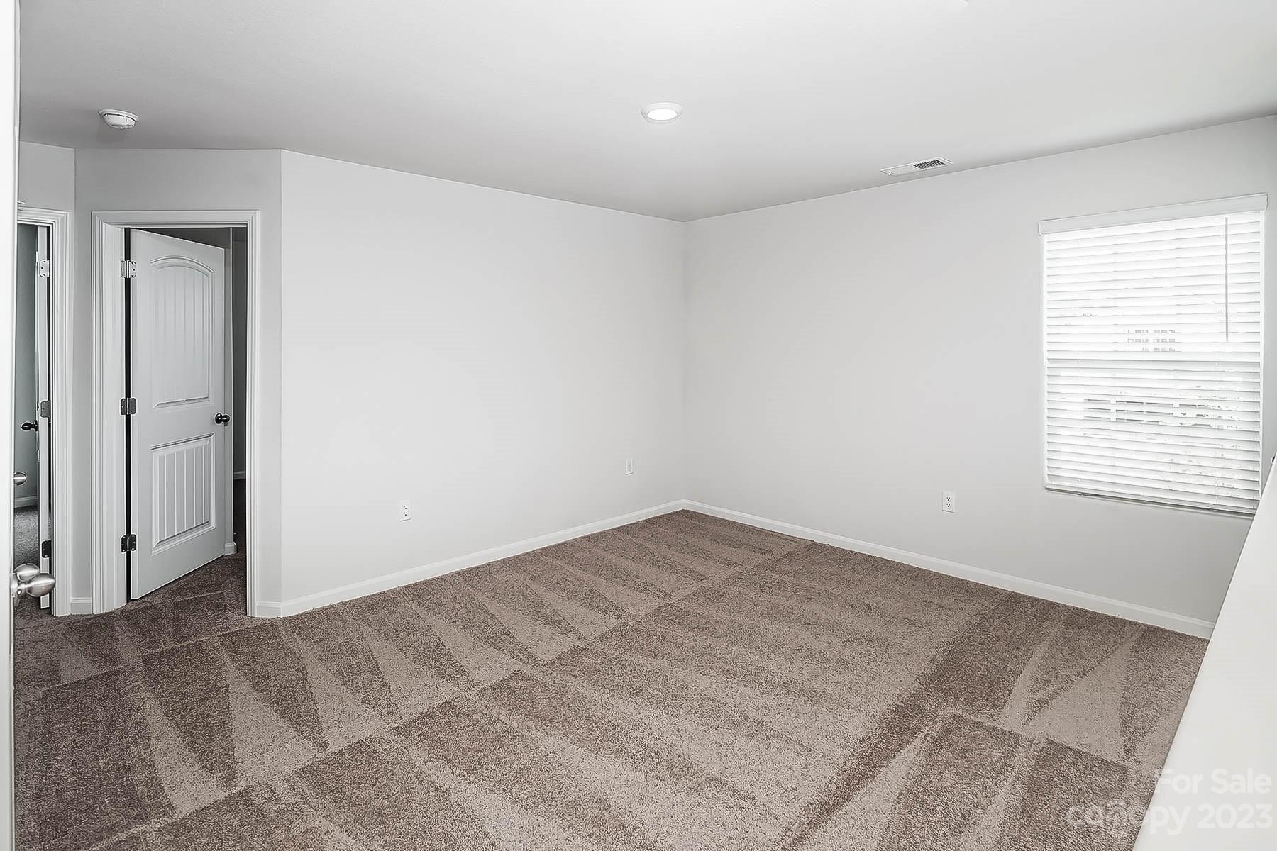 1620 Nia Road Charlotte, NC 28215 - Photo 6 of 14 an empty room with windows