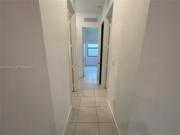 a view of a bathroom from a hallway