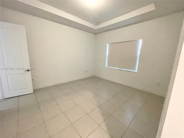 an empty room with a empty space and window
