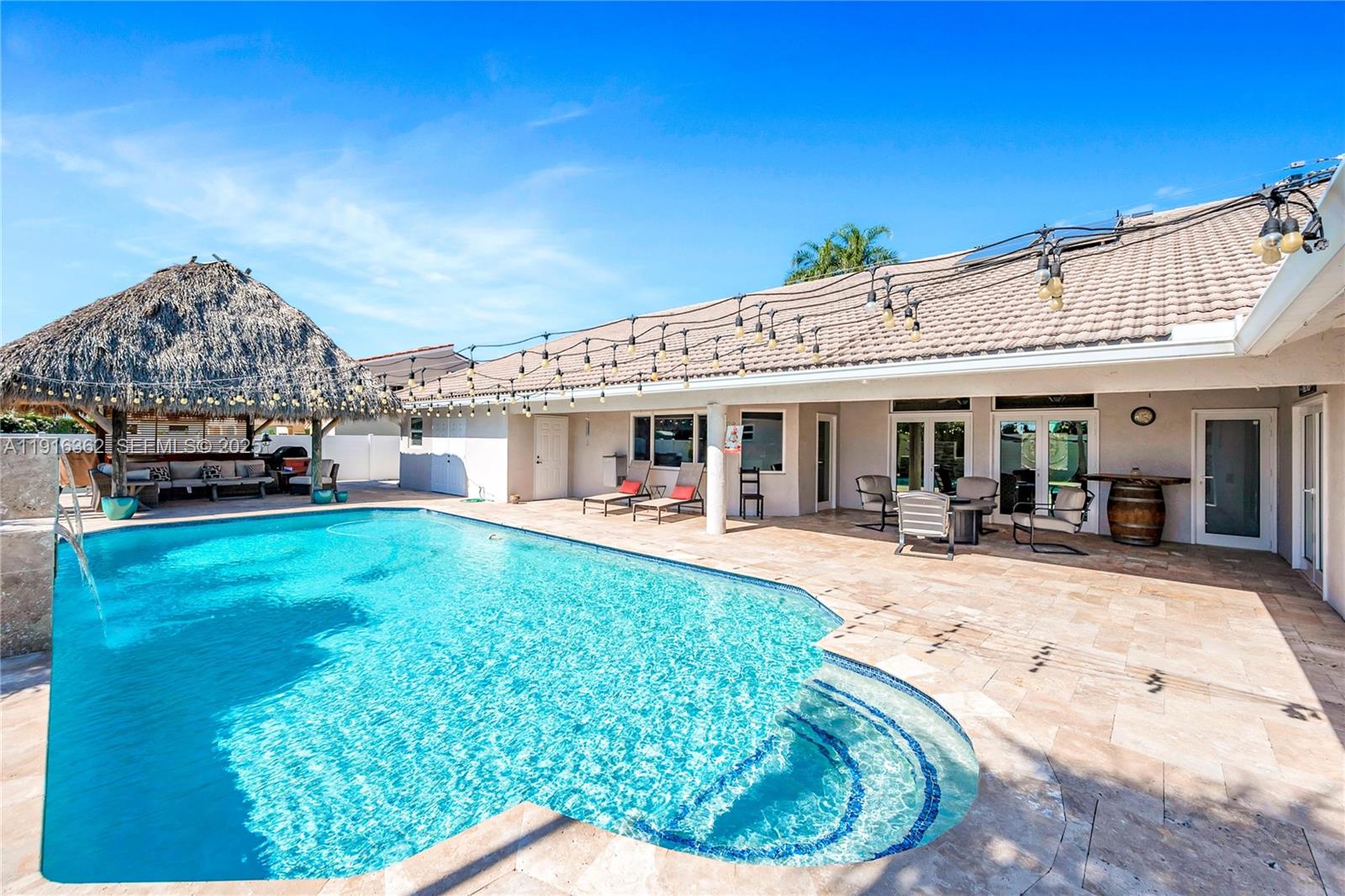 10700 Southwest 139th Road Miami, FL 33176 - Photo 12 of 68 a view of a house with backyard porch and sitting area