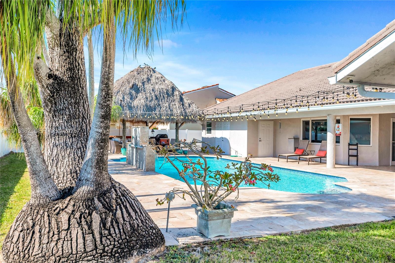 10700 Southwest 139th Road Miami, FL 33176 - Photo 14 of 68 a front view of a house with garden