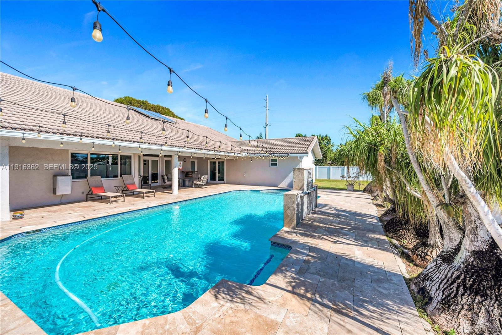10700 Southwest 139th Road Miami, FL 33176 - Photo 16 of 68 a view of a house with backyard porch and sitting area