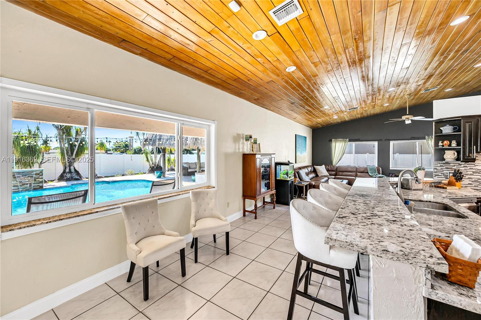 10700 Southwest 139th Road Miami, FL 33176 - Photo 30 of 68 a living room with furniture and a large window