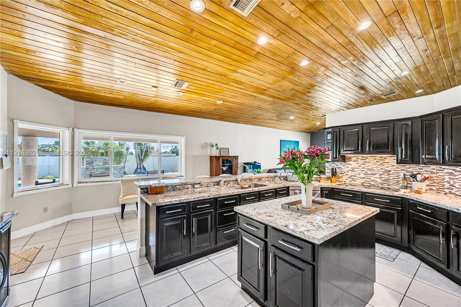 10700 Southwest 139th Road Miami, FL 33176 - Photo 31 of 68 a kitchen with a stove and cabinets