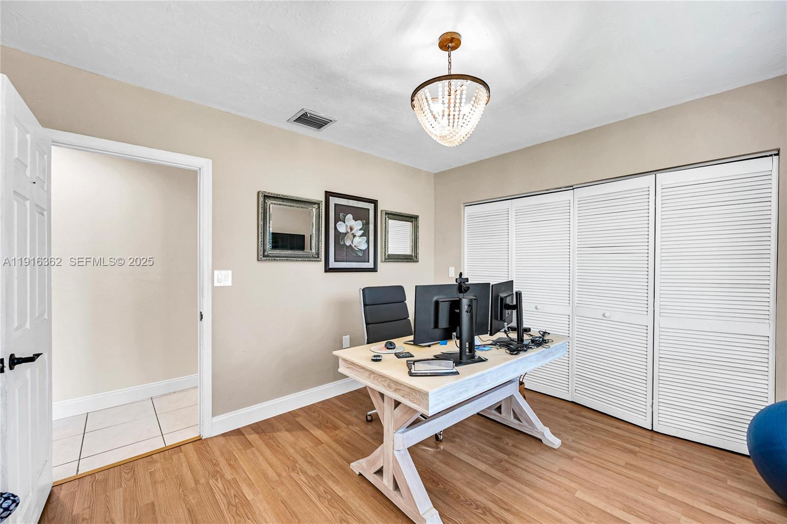 10700 Southwest 139th Road Miami, FL 33176 - Photo 39 of 68 a living room with a couch and a table