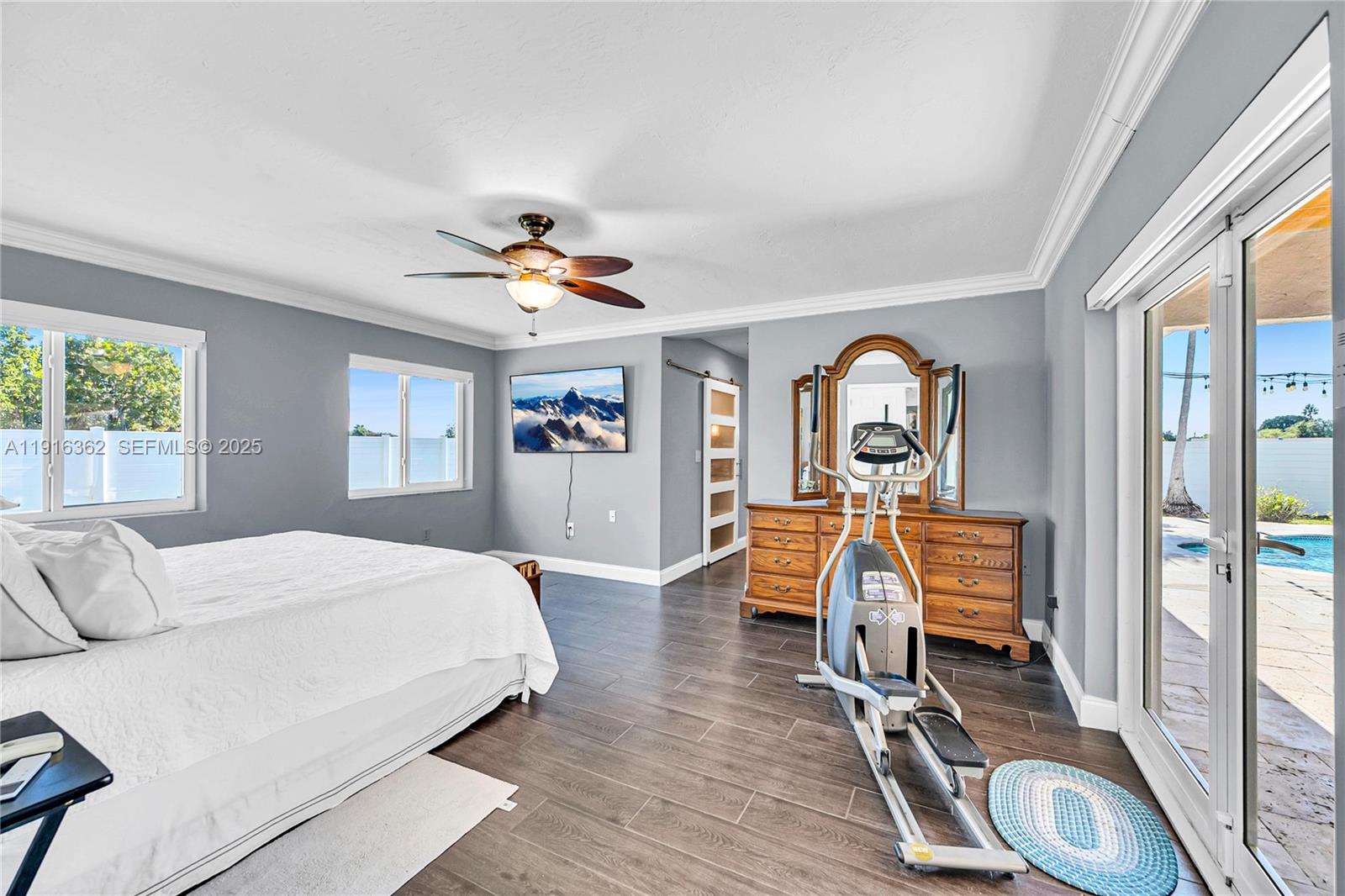 10700 Southwest 139th Road Miami, FL 33176 - Photo 41 of 68 a view of a bedroom with furniture window and wooden floor