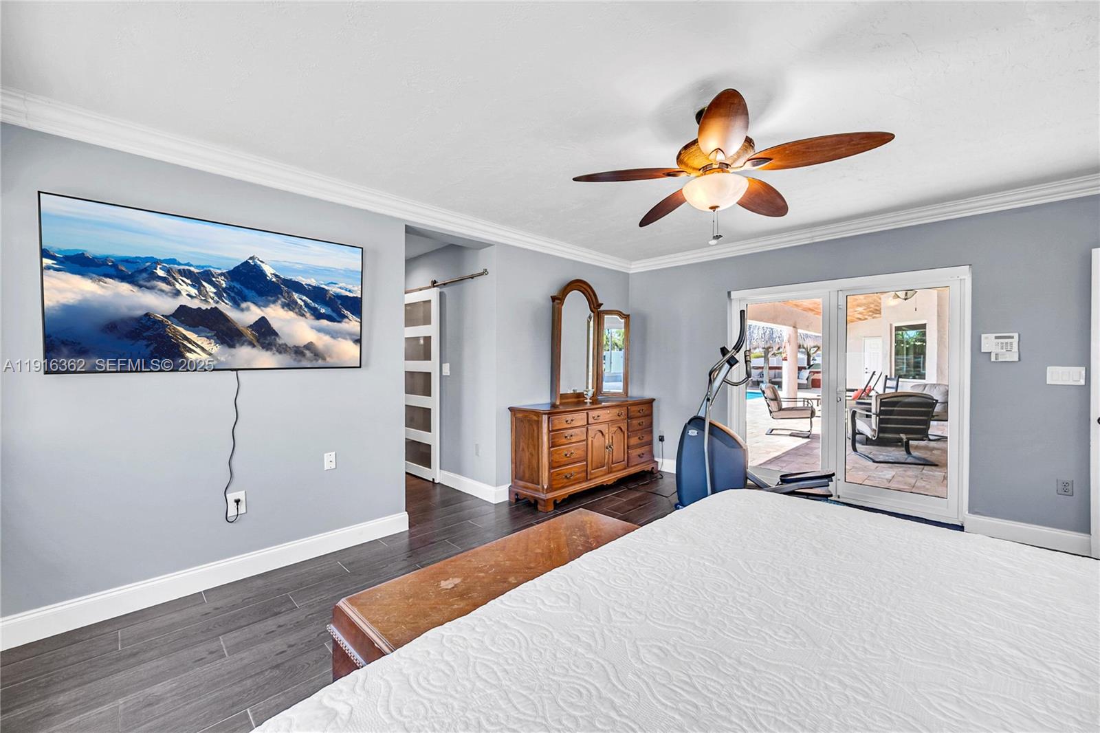 10700 Southwest 139th Road Miami, FL 33176 - Photo 42 of 68 a bedroom with furniture and a chandelier