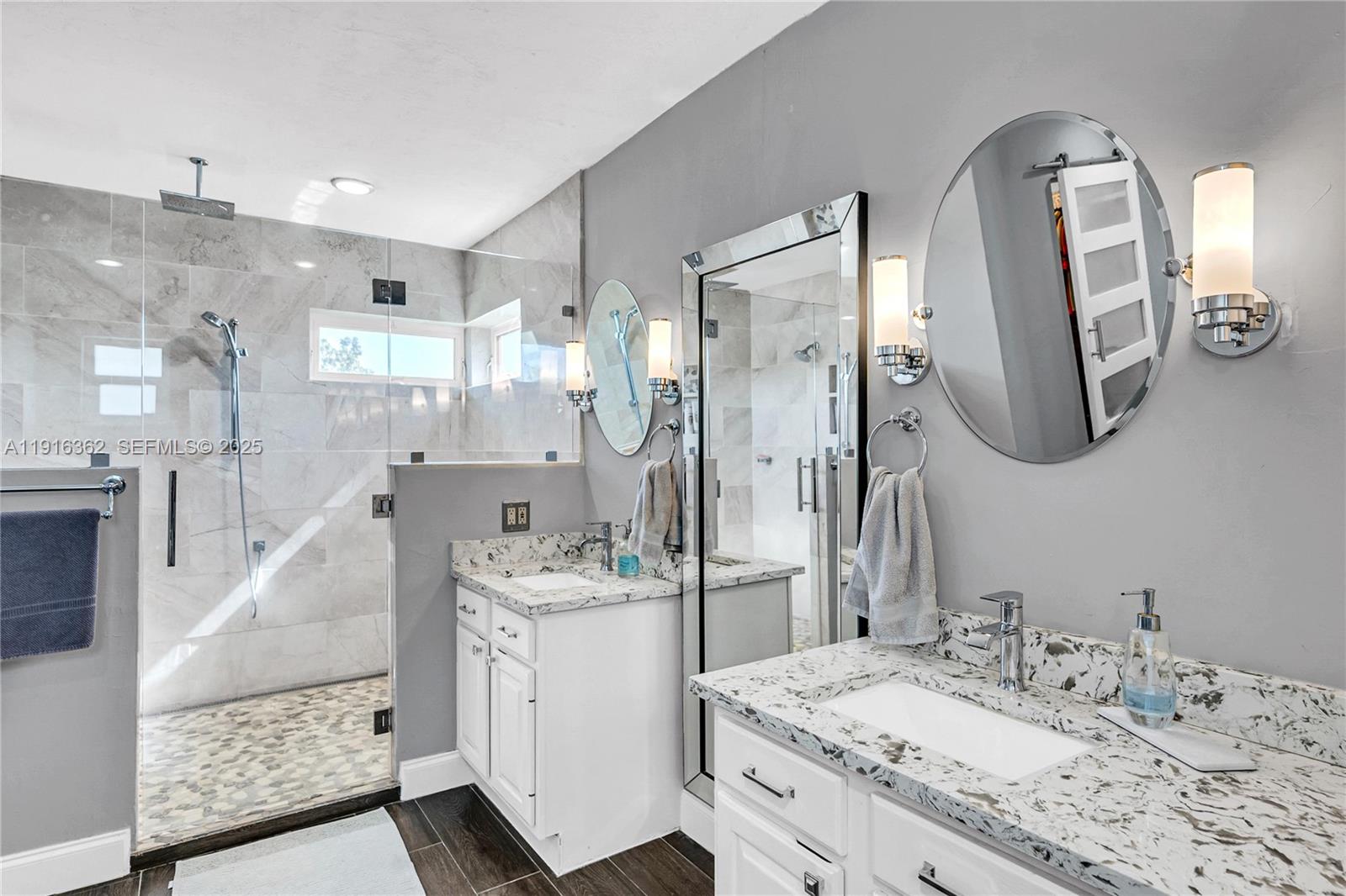 10700 Southwest 139th Road Miami, FL 33176 - Photo 45 of 68 a bathroom with a double vanity sink mirror and