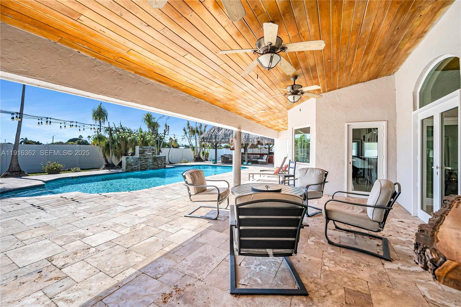 10700 Southwest 139th Road Miami, FL 33176 - Photo 49 of 68 a living room with patio furniture and garden view