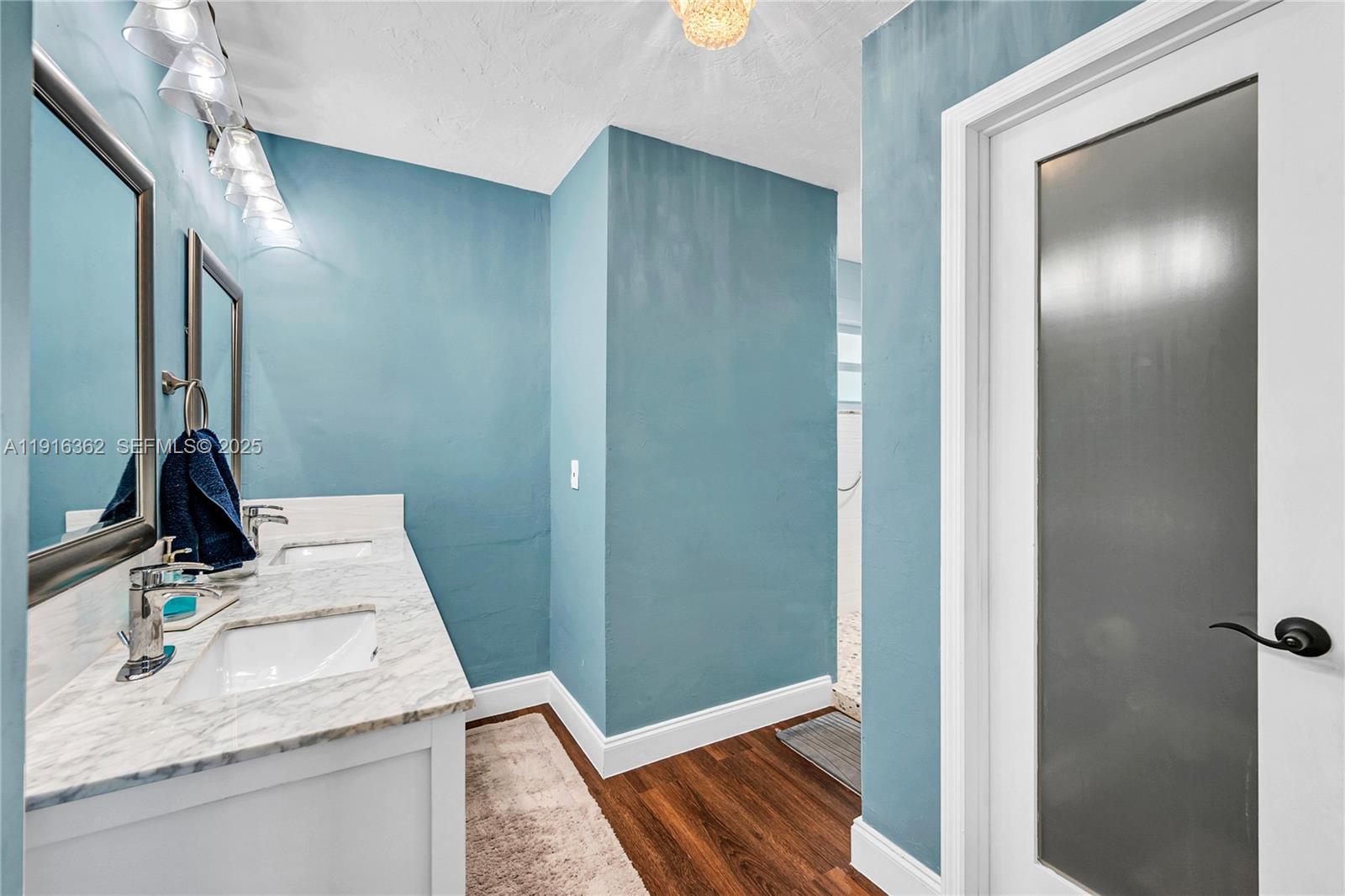 10700 Southwest 139th Road Miami, FL 33176 - Photo 54 of 68 a bathroom with a sink and a mirror