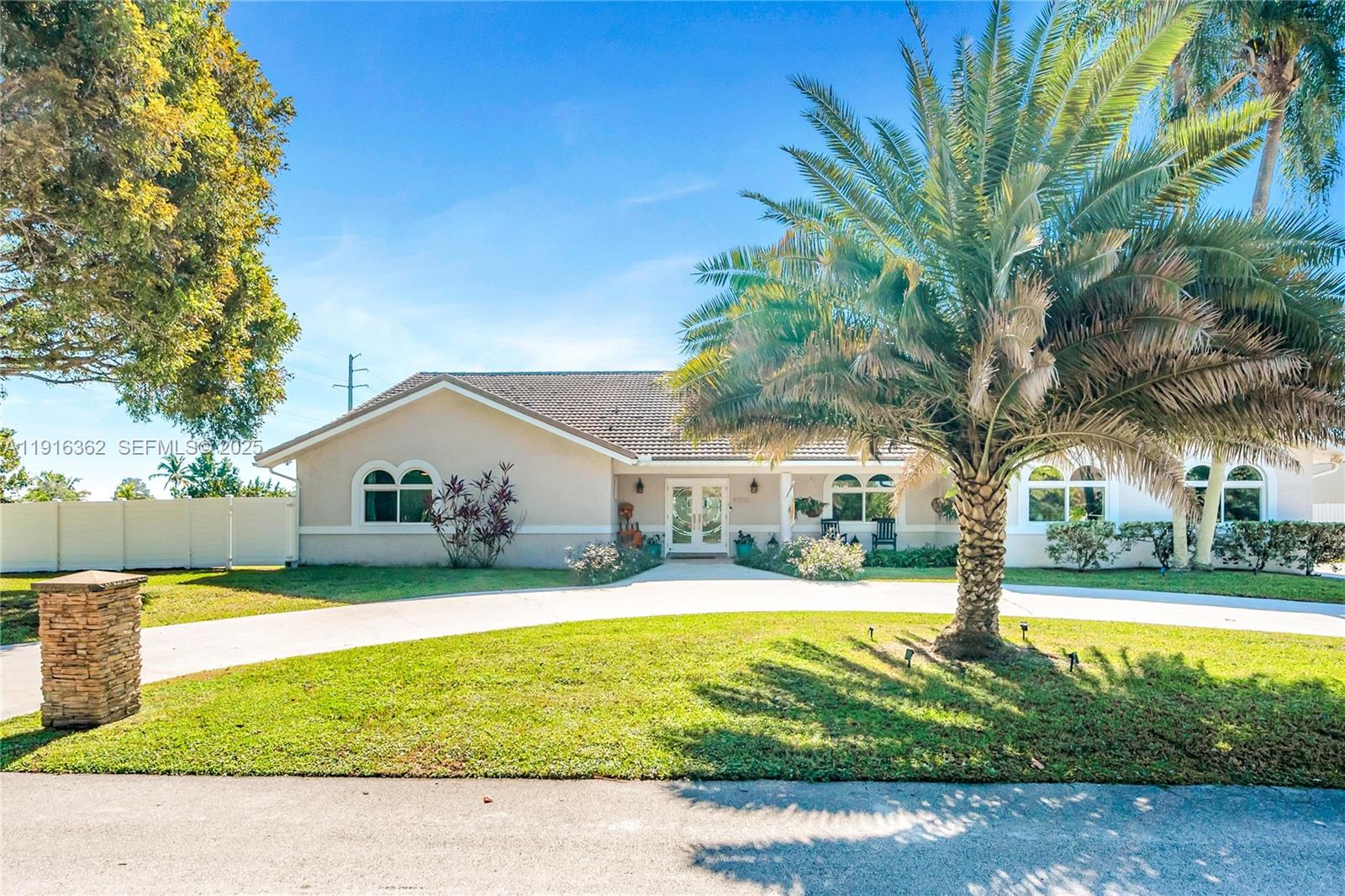 10700 Southwest 139th Road Miami, FL 33176 - Photo 6 of 68 a view of a house with swimming pool and a yard