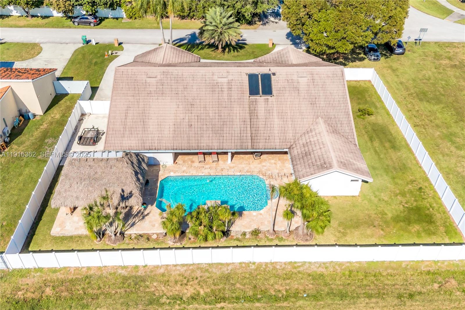 10700 Southwest 139th Road Miami, FL 33176 - Photo 64 of 68 a view of a swimming pool with a outdoor seating