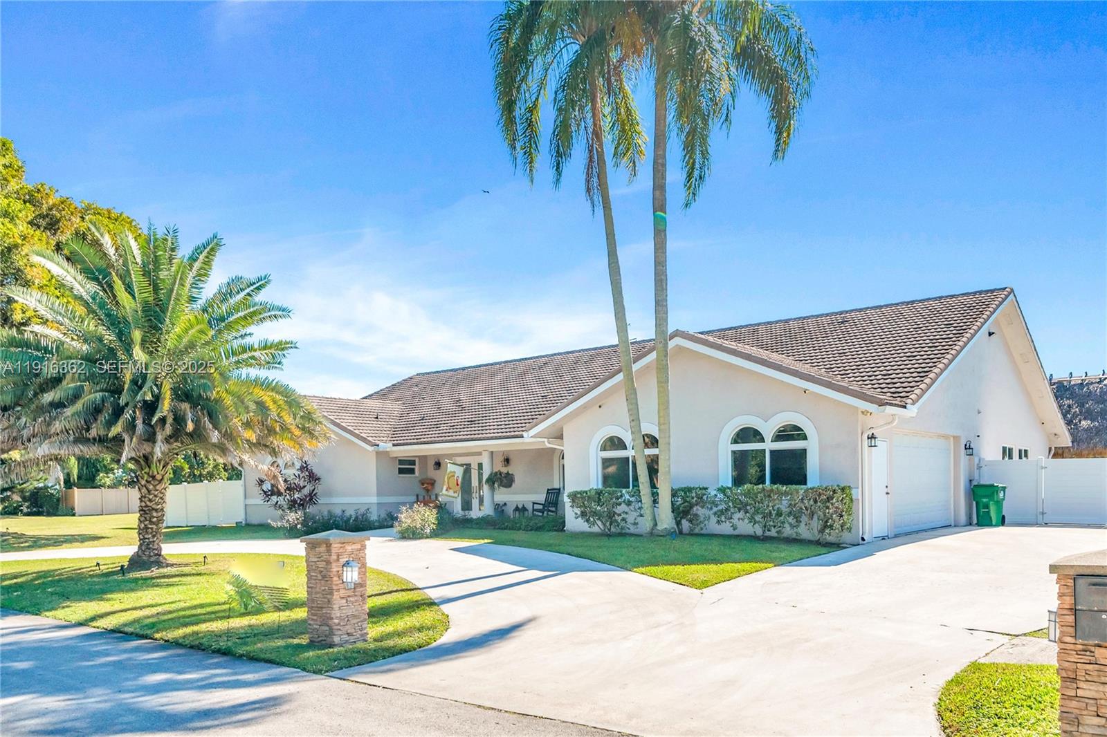 10700 Southwest 139th Road Miami, FL 33176 - Photo 7 of 68 a front view of a house with a patio