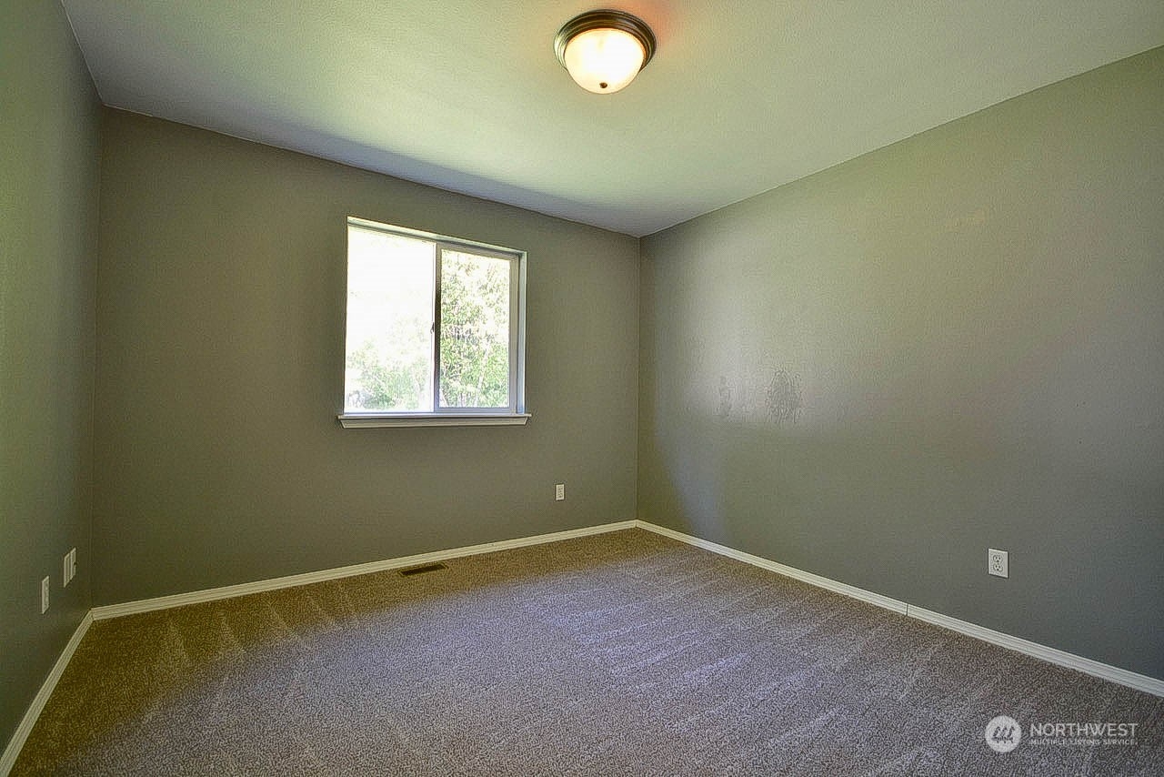 10306 3rd Street Southeast Yelm, WA 98597 - Photo 12 of 21 an empty room with windows