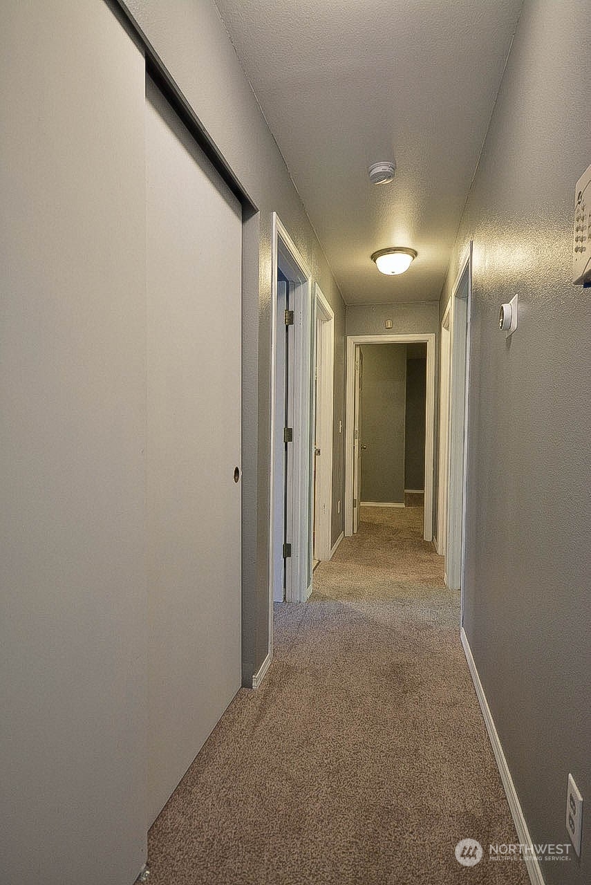 10306 3rd Street Southeast Yelm, WA 98597 - Photo 14 of 21 a view of hallway with a hallway