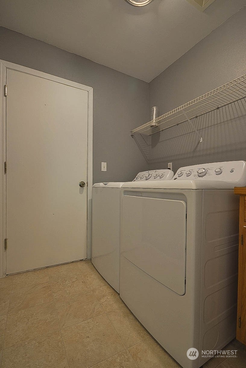10306 3rd Street Southeast Yelm, WA 98597 - Photo 17 of 21 a utility room with dryer and washer