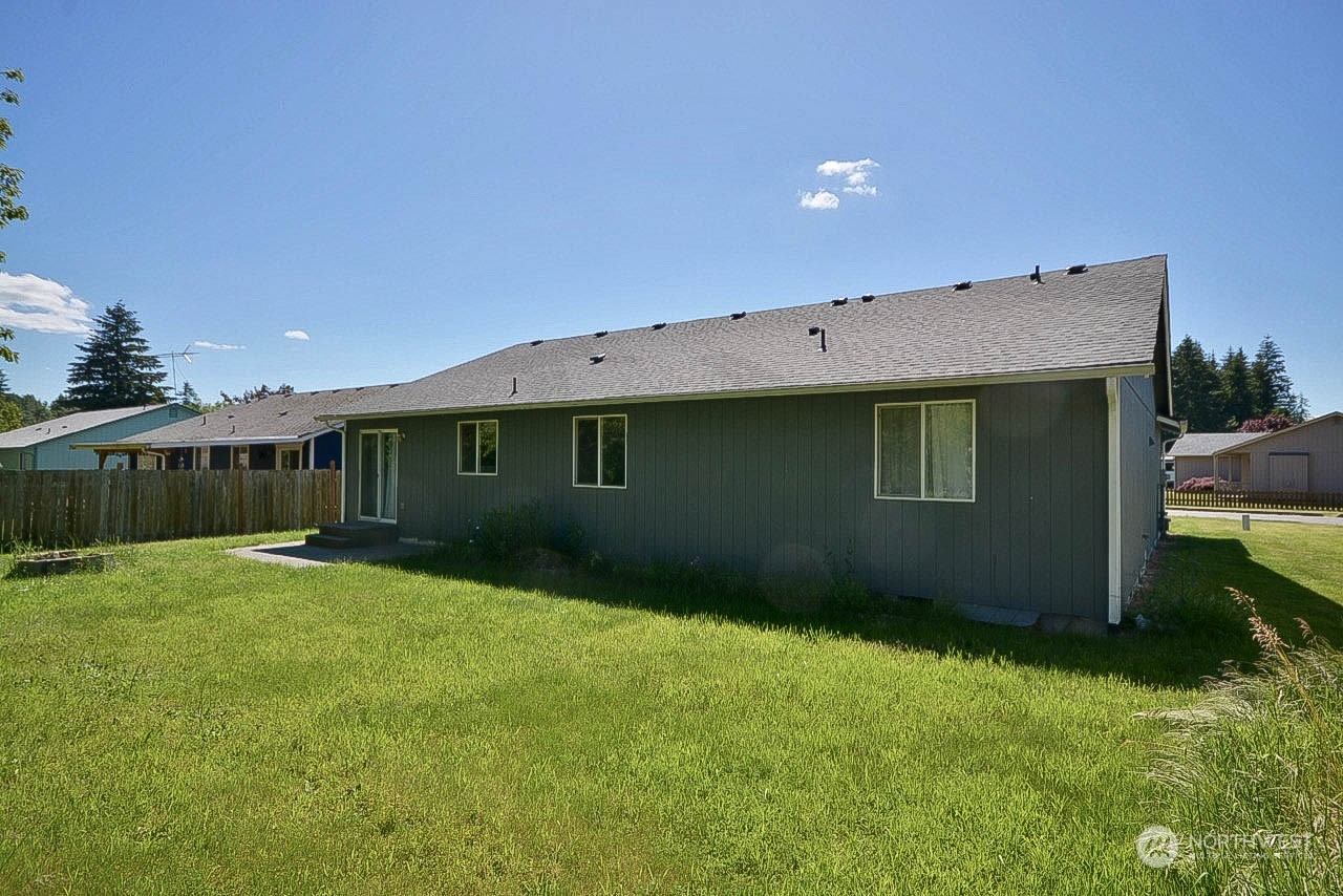 10306 3rd Street Southeast Yelm, WA 98597 - Photo 19 of 21 a backyard of a house with lots of green space