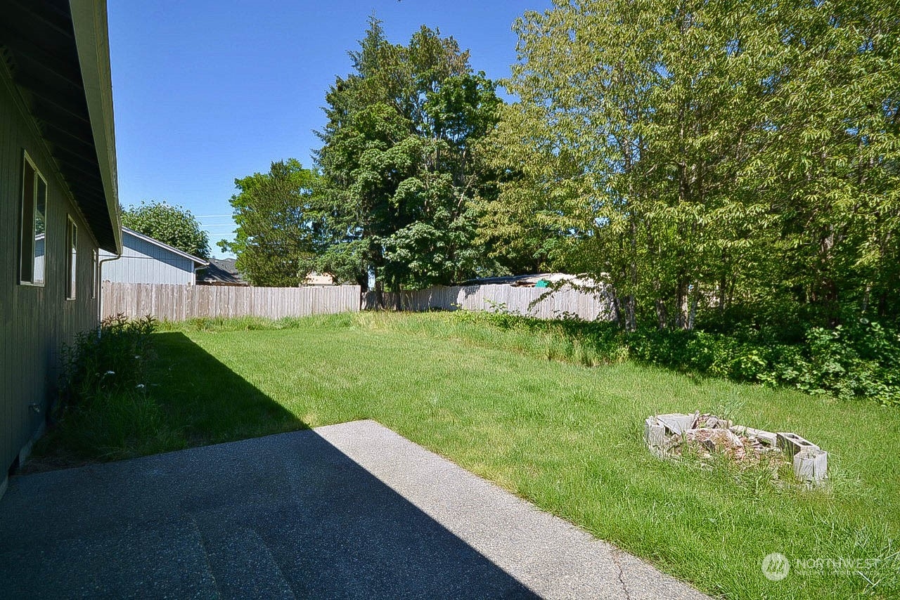 10306 3rd Street Southeast Yelm, WA 98597 - Photo 21 of 21 a view of a garden with a fountain