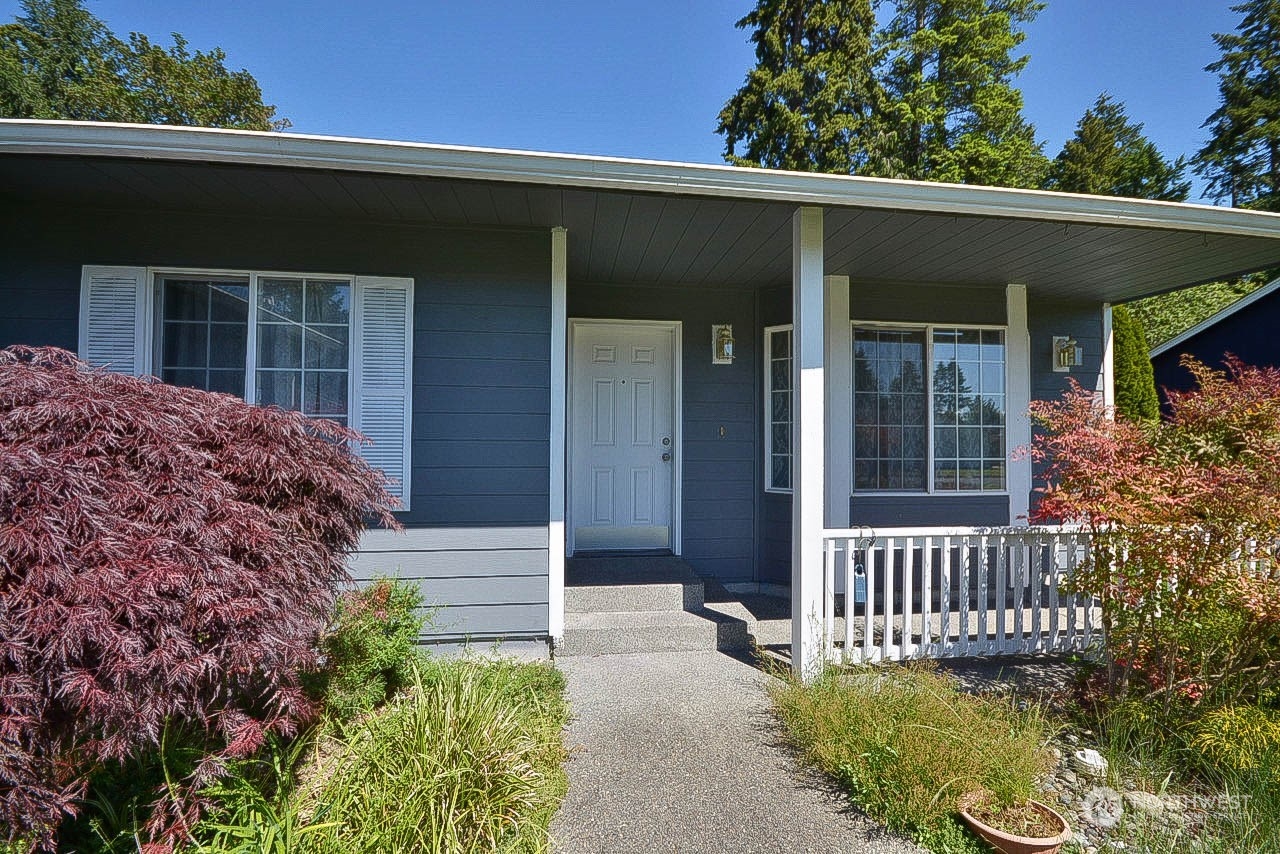 10306 3rd Street Southeast Yelm, WA 98597 - Photo 3 of 21 front view of a house with a yard