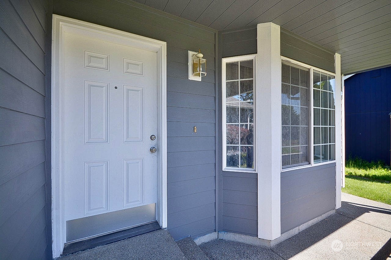 10306 3rd Street Southeast Yelm, WA 98597 - Photo 4 of 21 a view of front door and porch