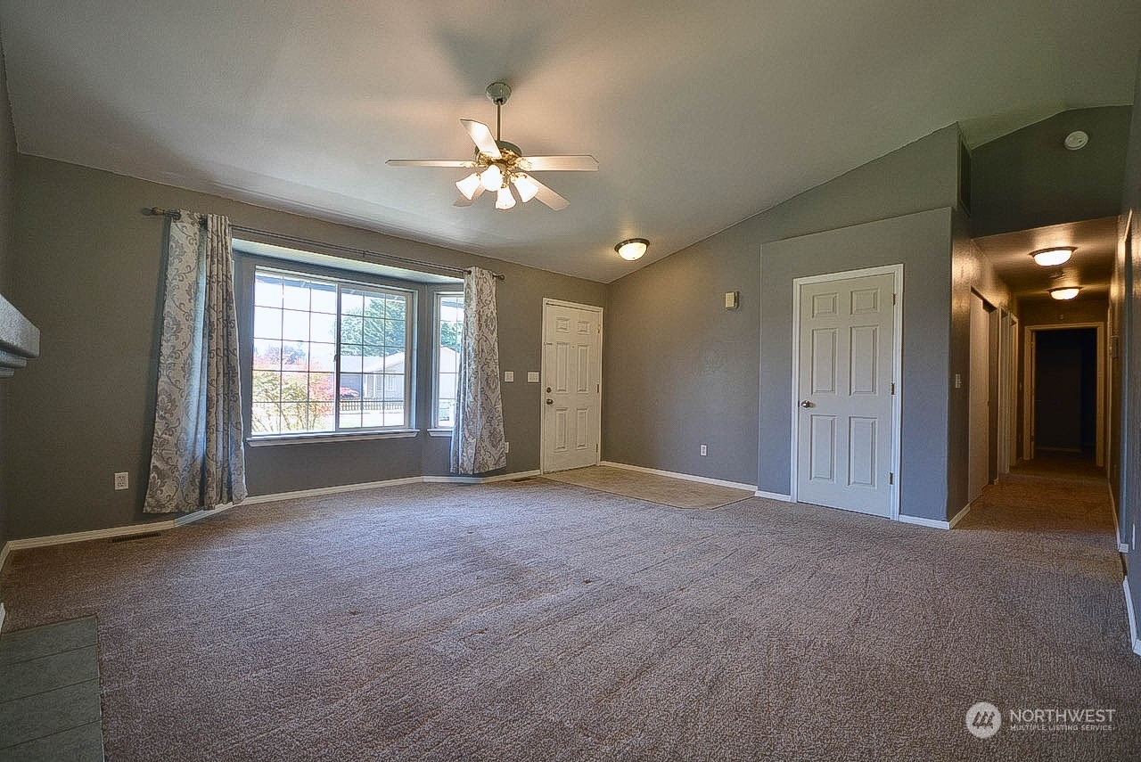 10306 3rd Street Southeast Yelm, WA 98597 - Photo 7 of 21 a view of an empty room with a window