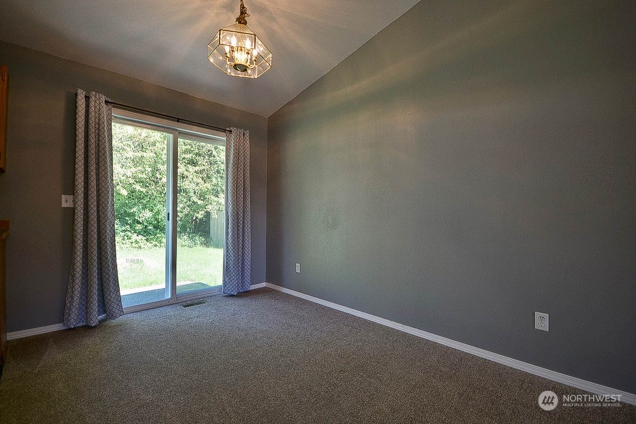10306 3rd Street Southeast Yelm, WA 98597 - Photo 8 of 21 an empty room with windows and outdoor view