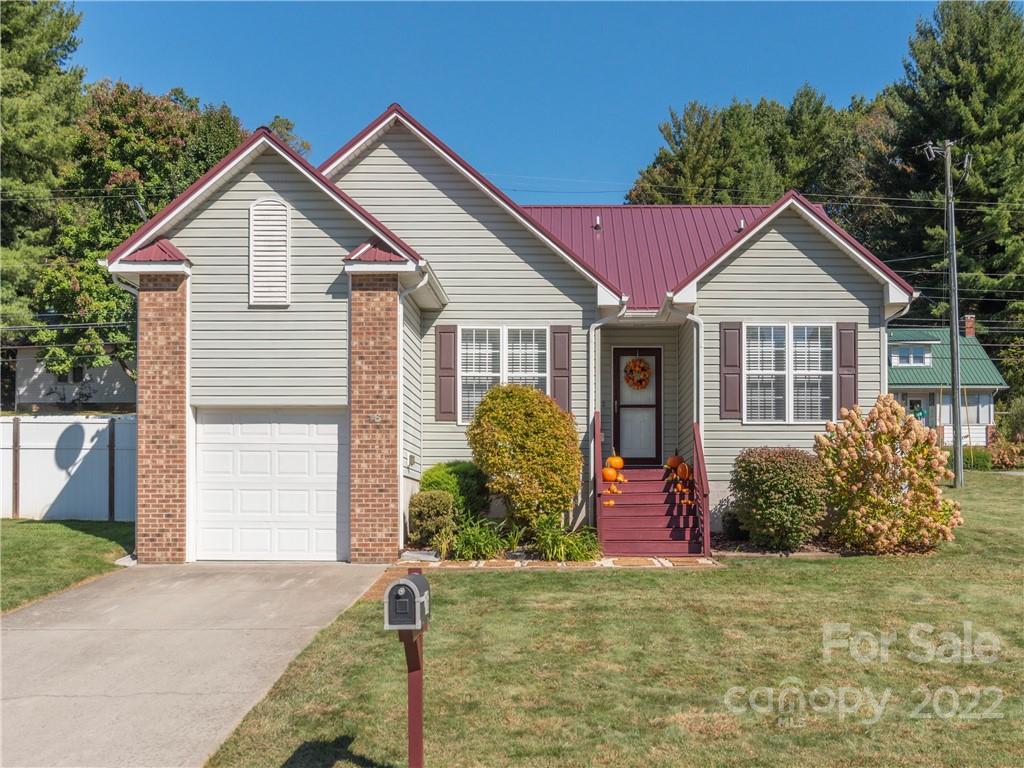 16 Village Street Clyde, NC 28721 - Photo 1 of 21 a front view of a house with garden