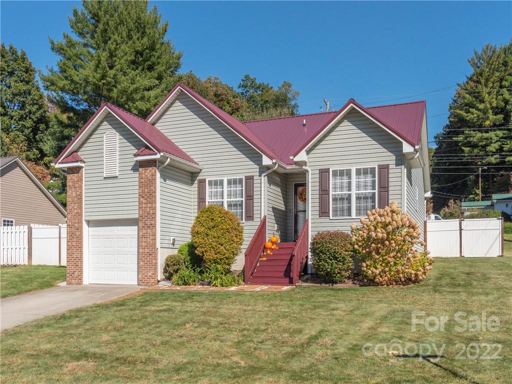 16 Village Street Clyde, NC 28721 - Photo 21 of 21 a front view of a house with a yard