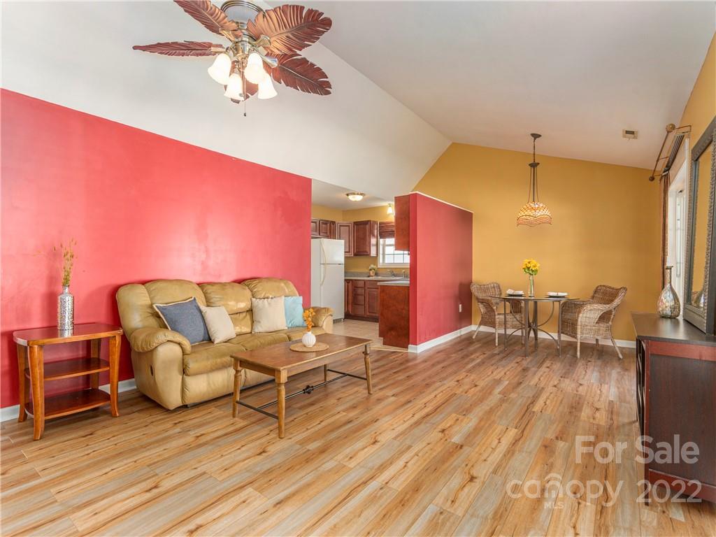 16 Village Street Clyde, NC 28721 - Photo 6 of 21 a living room with furniture and a wooden floor