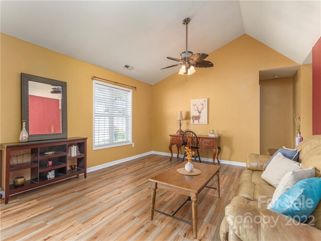 16 Village Street Clyde, NC 28721 - Photo 8 of 21 a living room with furniture and wooden floor