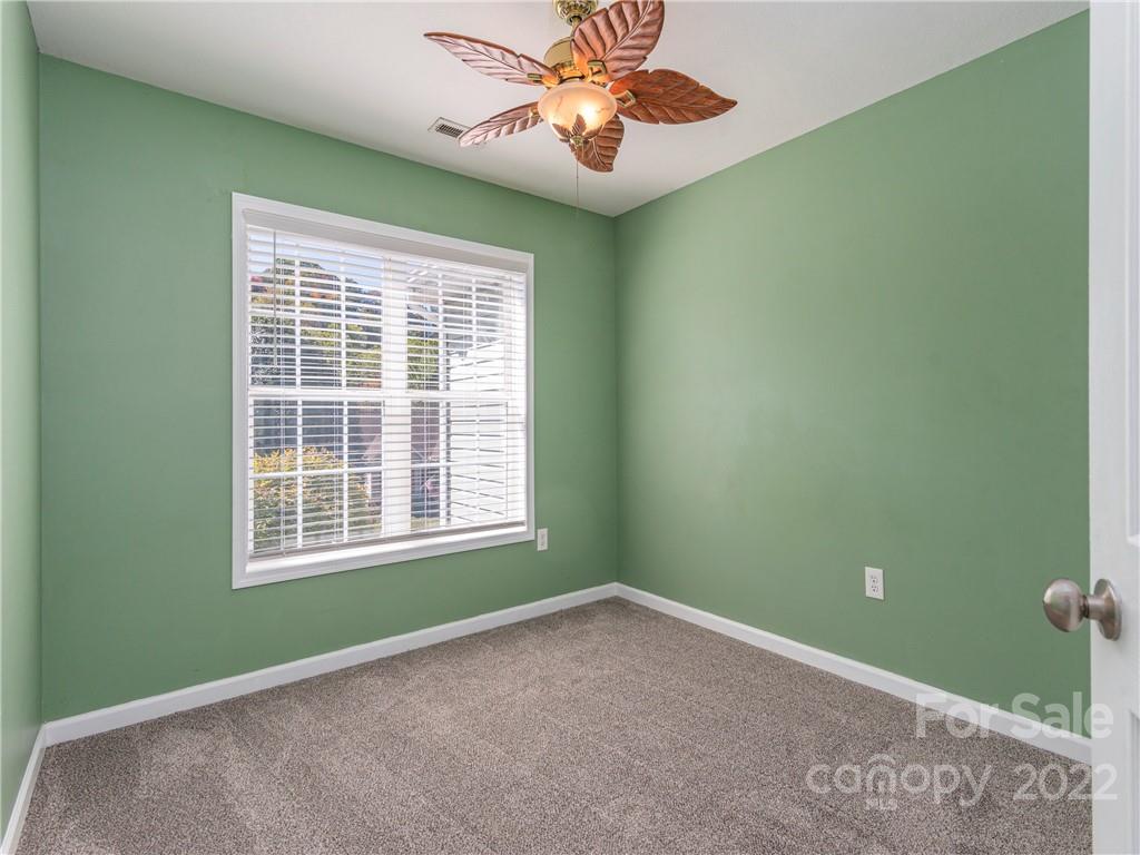 16 Village Street Clyde, NC 28721 - Photo 10 of 21 a view of a livingroom with a ceiling fan and a window