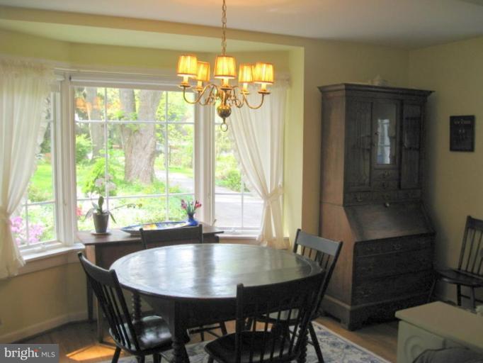 11811 Ridgemont Road Lutherville-Timonium, MD 21093 - Photo 16 of 17 a view of a dining room with furniture window and outside view