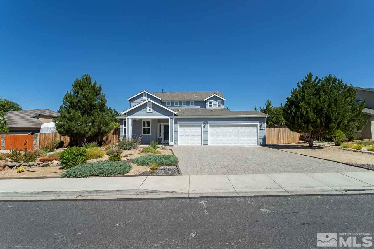981 South University Reno, NV 89512 - Photo 1 of 19 a front view of a house with a yard and garage