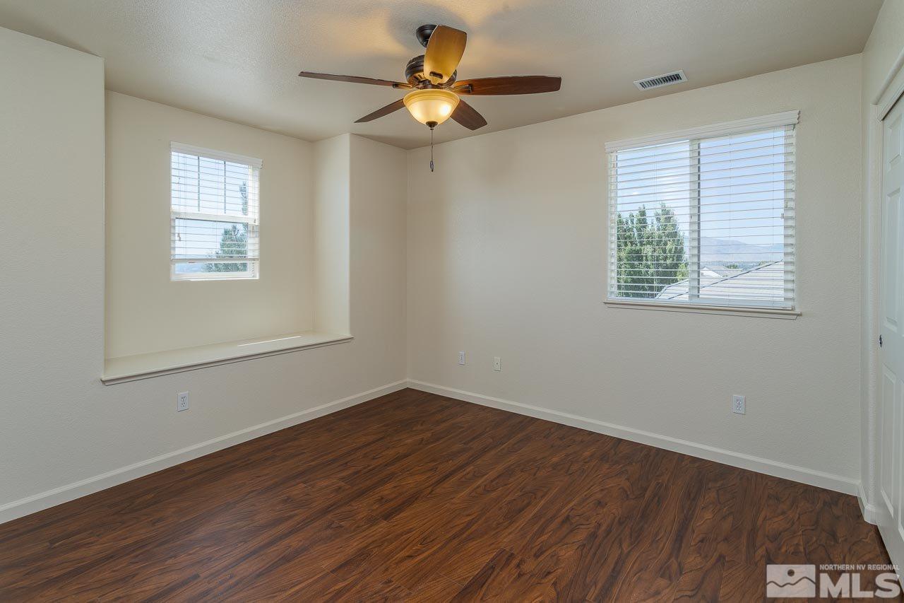 981 South University Reno, NV 89512 - Photo 11 of 19 a view of a room with wooden floor and a window