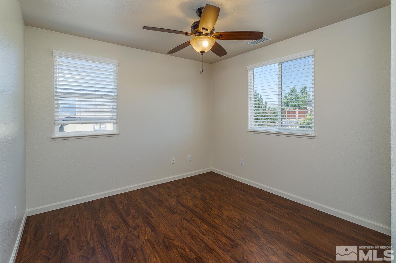 981 South University Reno, NV 89512 - Photo 13 of 19 a view of an empty room with wooden floor and a window