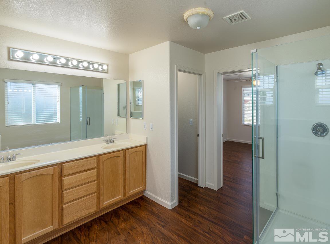 981 South University Reno, NV 89512 - Photo 16 of 19 a spacious bathroom with a double vanity sink and a mirror