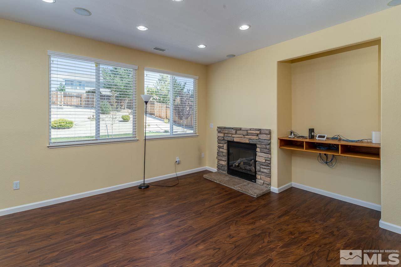 981 South University Reno, NV 89512 - Photo 5 of 19 a view of a livingroom with an empty space and a fireplace